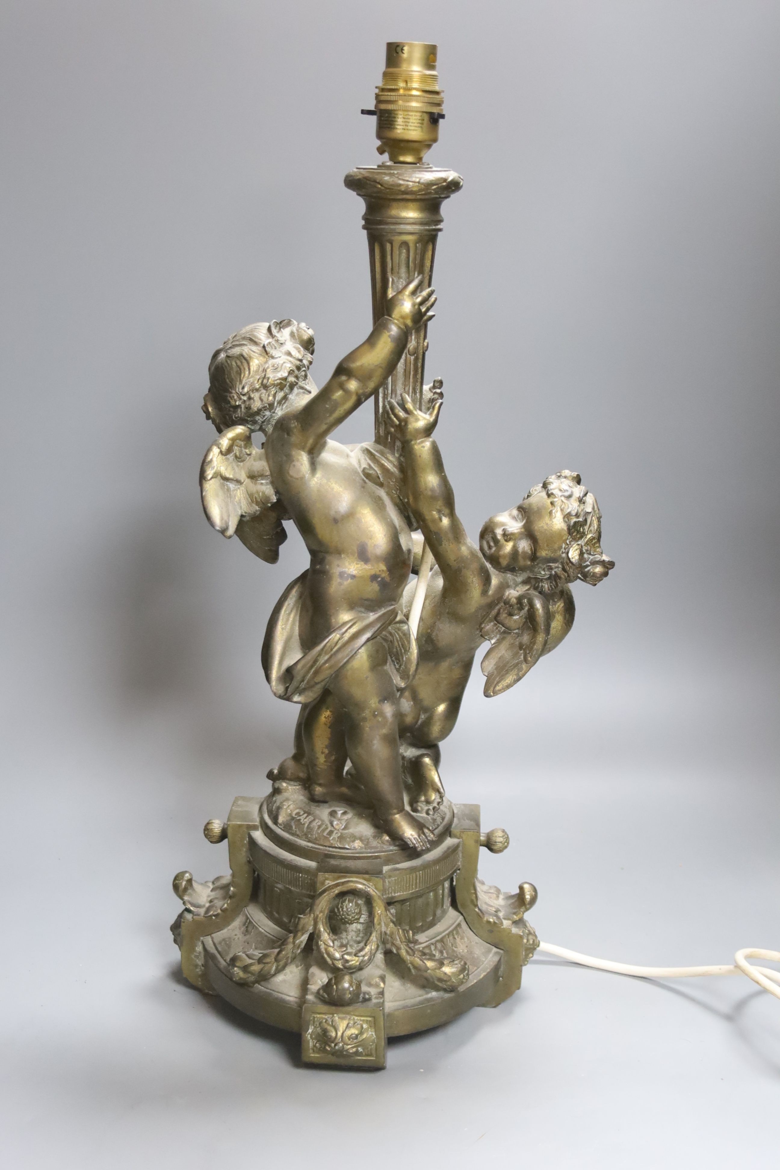 A gilt metal cherubic table lamp, signed, overall height 50cm